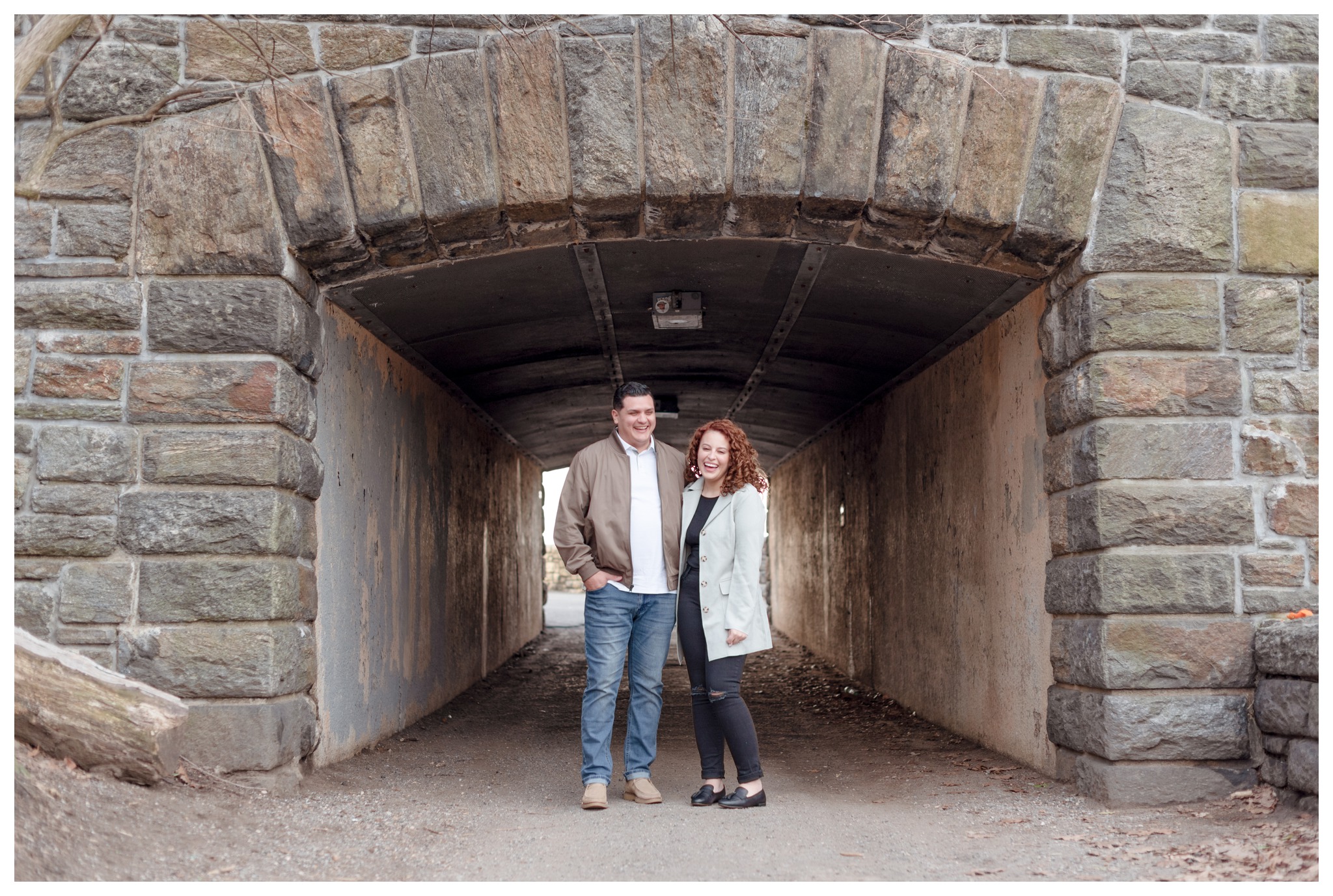 fort tryon park engagement session under stone arches